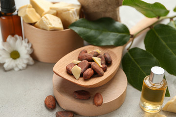 Beautiful composition with cocoa butter lotion on table