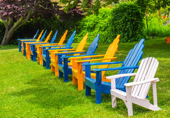 Row of Lounge Chairs On Grass