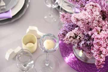 Obraz na płótnie Canvas Beautiful table setting with lilac bouquet