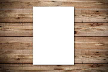 Top view of blank paper page on wood background office desk with different objects. Minimal flat lay style