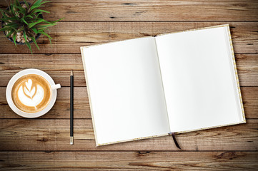 Top view of blank open notebook page on wood background office desk with coffee cup. Minimal flat lay style