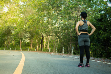 Young fitness women preparing to run on the street.