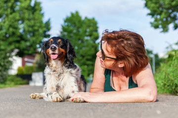 portrait of a mature woman with Brittany dog