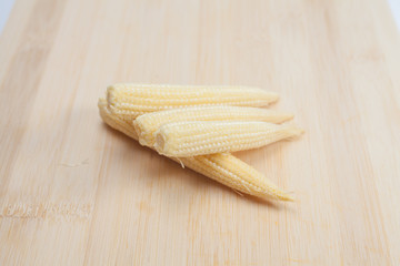 baby corn on wooden background