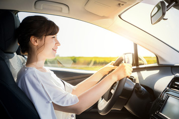 young woman driving a car.