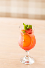 cocktail with orange and strawberry