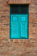 Fototapeta premium Brick wall blocks, brown trimmed with green windows.,concept art