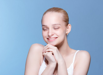Obraz na płótnie Canvas Happy young woman with clean skin.