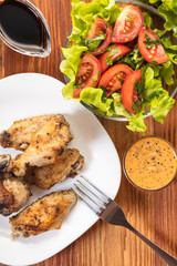 Chicken wings in sauce