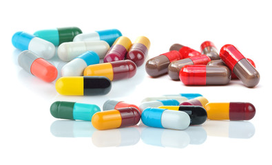  medical capsules on white background.