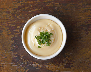 Sauce mustard and mayonnise on a wooden table.