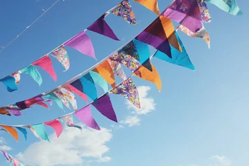  Summer festive colorful bunting and blue sky, summer event celebration © SewcreamStudio