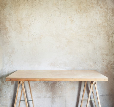 Table against concrete wall