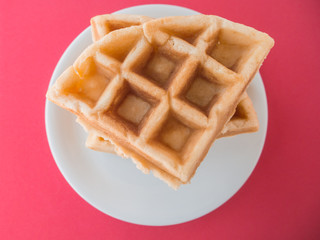waffle on red background.