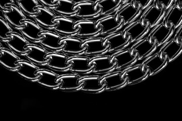 Chain heap - abstract metal background. Collection silver jewelry chains on an isolated black...