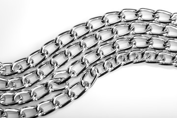 Chain heap - abstract metal background. Collection silver jewelry chains on an isolated black...