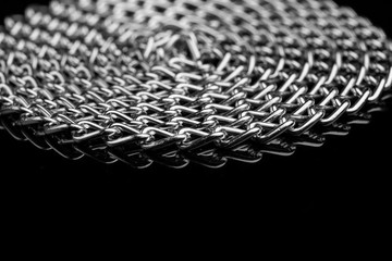 Chain heap - abstract metal background. Collection silver jewelry chains on an isolated black...