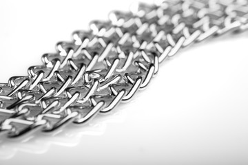 Chain heap - abstract metal background. Collection silver jewelry chains on an isolated black...