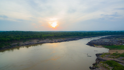 aerial photography around grand canyon in Mekong river. 3000 bok mean 3000 holes,holes eroded into the rock along Mekong river. color of water inside the holes after low tide is emerald green