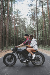 Obraz na płótnie Canvas Caucasian couple on motorcycle