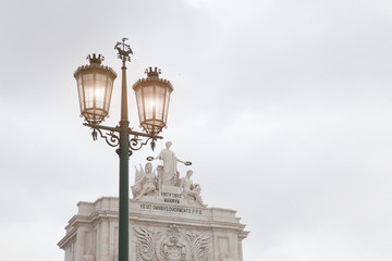 Fototapeta na wymiar Old street lamp in Lisbon, detail of an old lighting in the city.