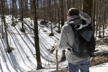 Fototapeta na wymiar hiker on mountain trail with snow