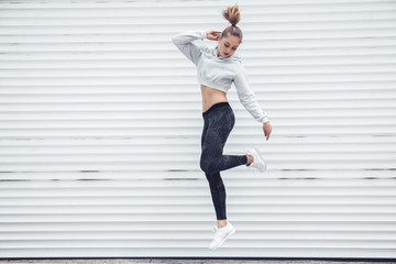 Fitness sporty girl wearing fashion clothes - obrazy, fototapety, plakaty