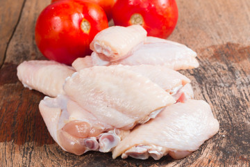 Fresh Chicken wing isolate on wooden table
