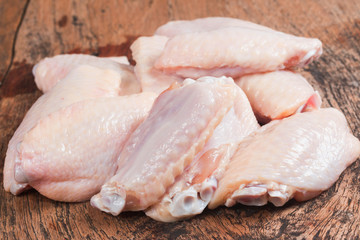 Fresh Chicken wing isolate on wooden table
