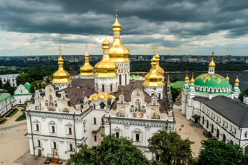 Fototapeta na wymiar picturesque view of cupolas of Kyiv Pechersk Lavra monastery from bell tower, Ukraine