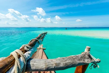 Foto op Plexiglas amazing view of blue sky and turquiose ocean from wooden african boat © Ievgen Skrypko