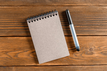 Notepad on the wooden desk table