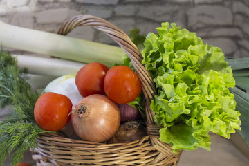 Fresh vegetables in a wicker basket. Selective focus.