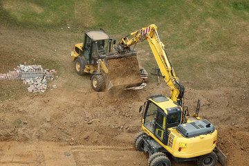 excavator and loader in action