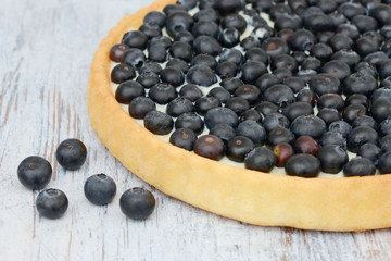blueberry fruit cake on wood