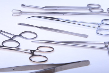 Close Up Surgical instruments and tools on white background. Selective focus.