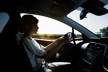 Fototapeta na wymiar silhouette of woman driver.
