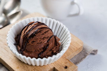 Chocolate ice cream in white bowl