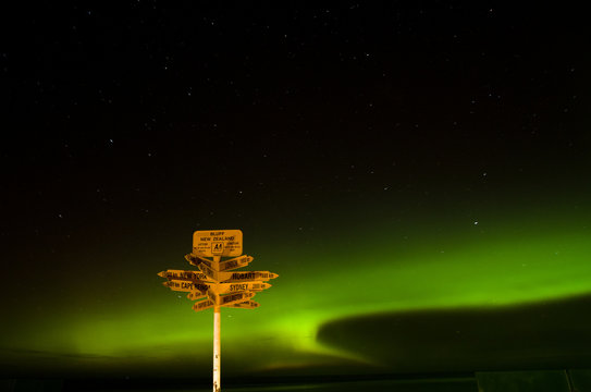 Signpost Under Aurora In Stirling Point