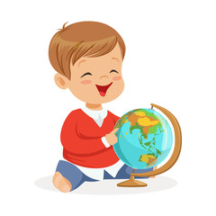 Smiling little boy sitting and playing with globe. Child learning the world colorful cartoon character vector Illustration