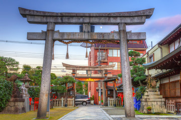 Historical torii gate in Kyoto at sunset, Japan