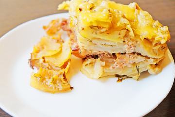 potato casserole with Turkey meat in a white plate. close up.