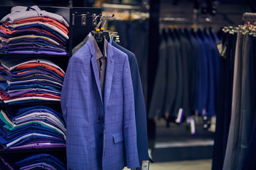 Men's jackets on hangers in the men's store