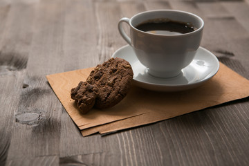 coffee cup and cookies on wooden table