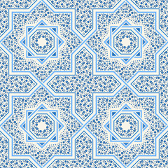 Patterned floor tile. Moroccan pattern design. Eight-ray star. Seamless vector pattern. Vector illustration. Moorish mosaic in blue. Small flowers in octagon star shape.