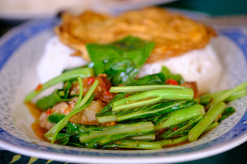 Fried kale with crispy pork with rice