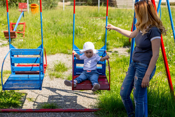 Fototapeta na wymiar Cute baby girl playing in the playground