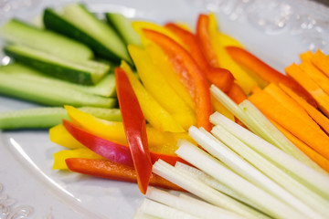 Carrots, cucumber, sweet pepper and celery chopped with chopsticks