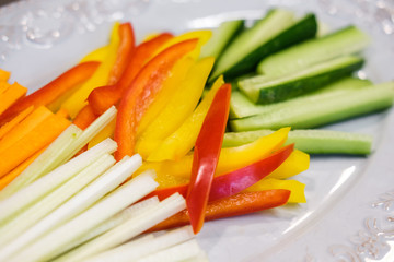 Carrots, cucumber, sweet pepper and celery chopped with chopsticks