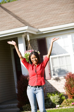 Home: Excited Woman Outside of Home